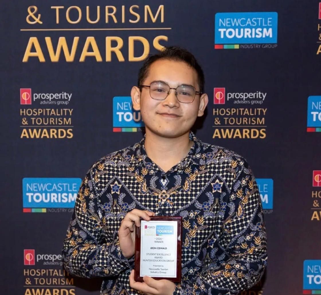 Leon Oswald holding his Student Excellence Award at the Newcastle Hospitality & Tourism Awards